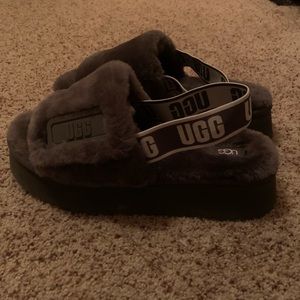 Size 10 ugg slippers with strap. Fits sizes 8+. Never worn, in great condition.